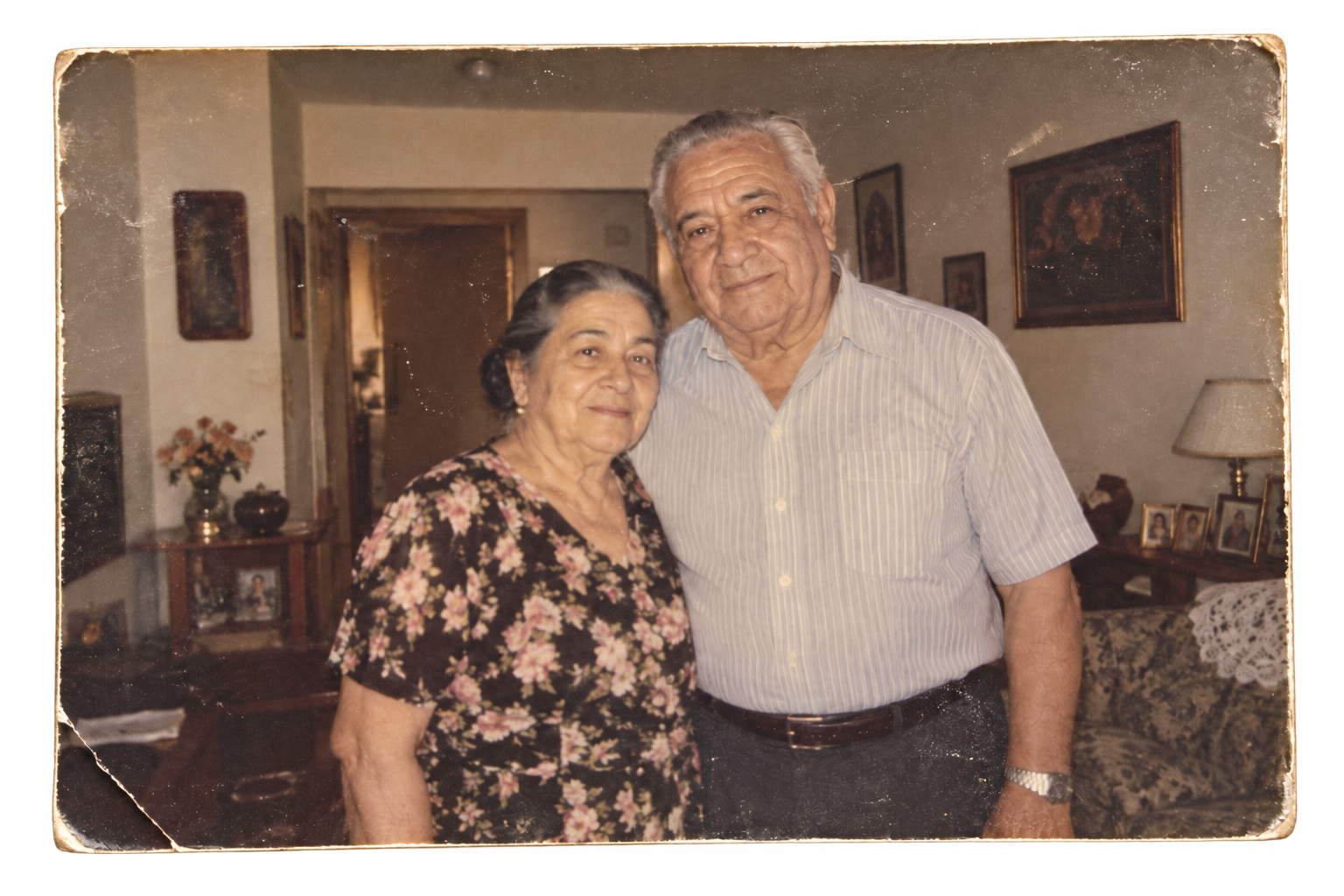 Carmen and Luis Delgado standing together in their West 84th Street apartment